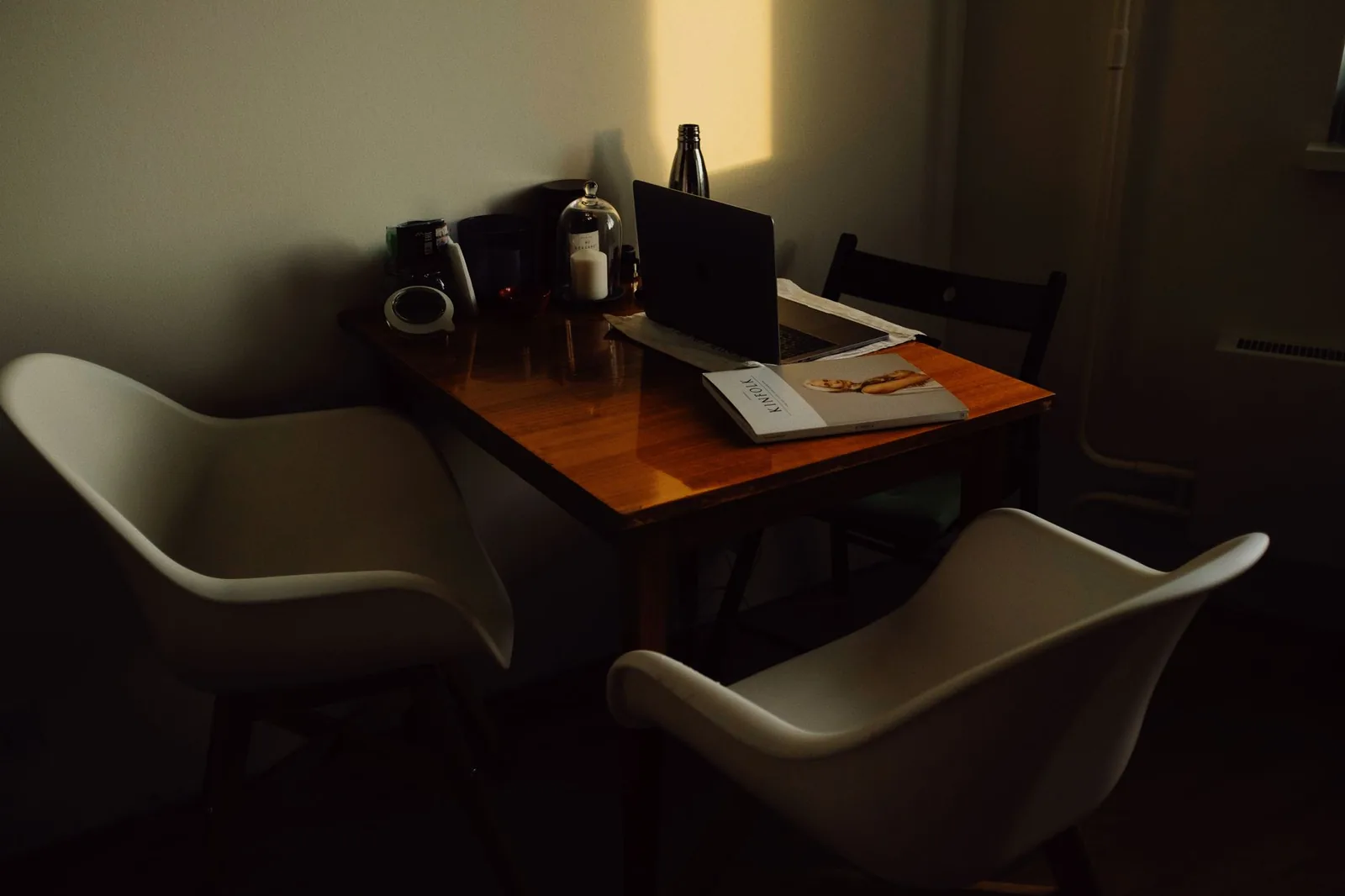 Solo entrepreneur working on a laptop at a home office desk, symbolizing home-based small business ideas for 2026
