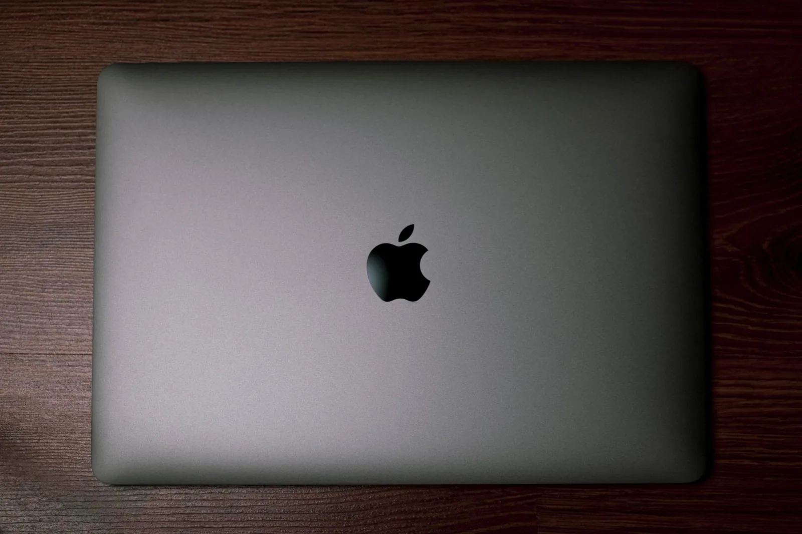 Abstract tech illustration: Apple Just Locked Down Mac Access for AI Agents