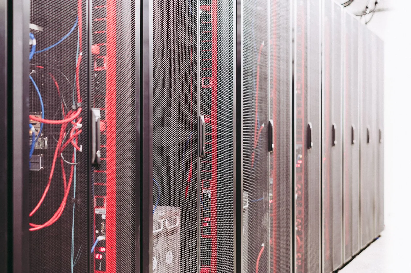 Data center server racks with network cables powering AWS OpenSearch retrieval infrastructure for AI agents