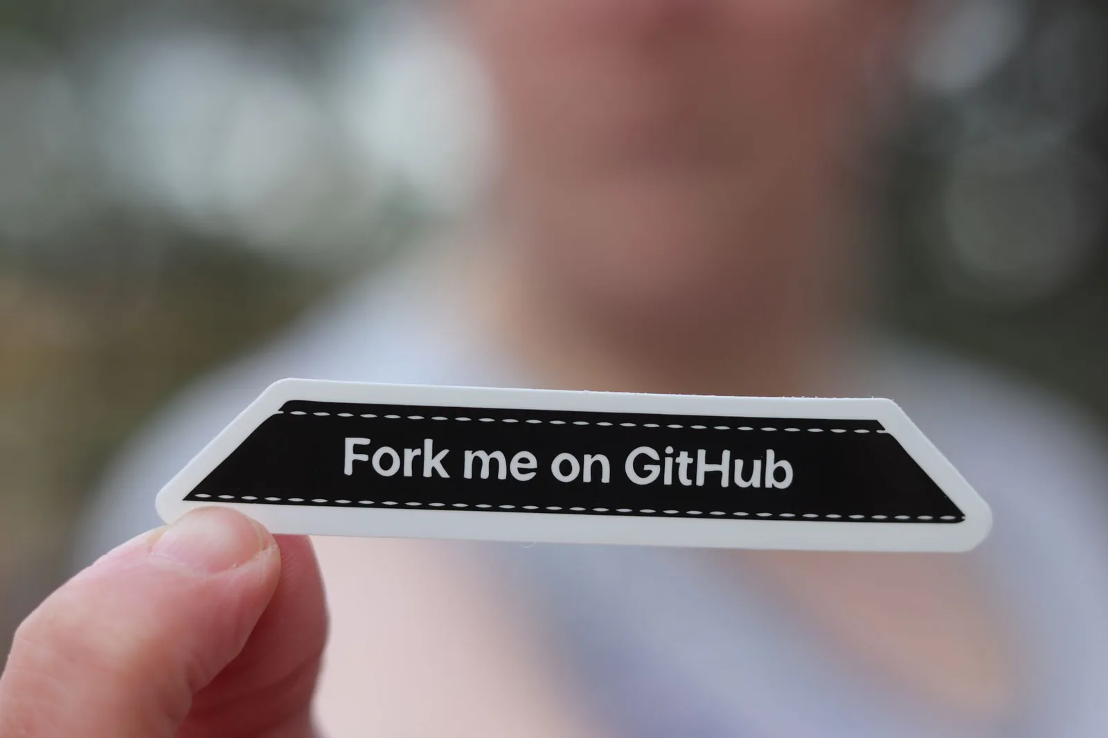 Abstract tech illustration: Developer Says Cracked Software Stayed on GitHub for a Month