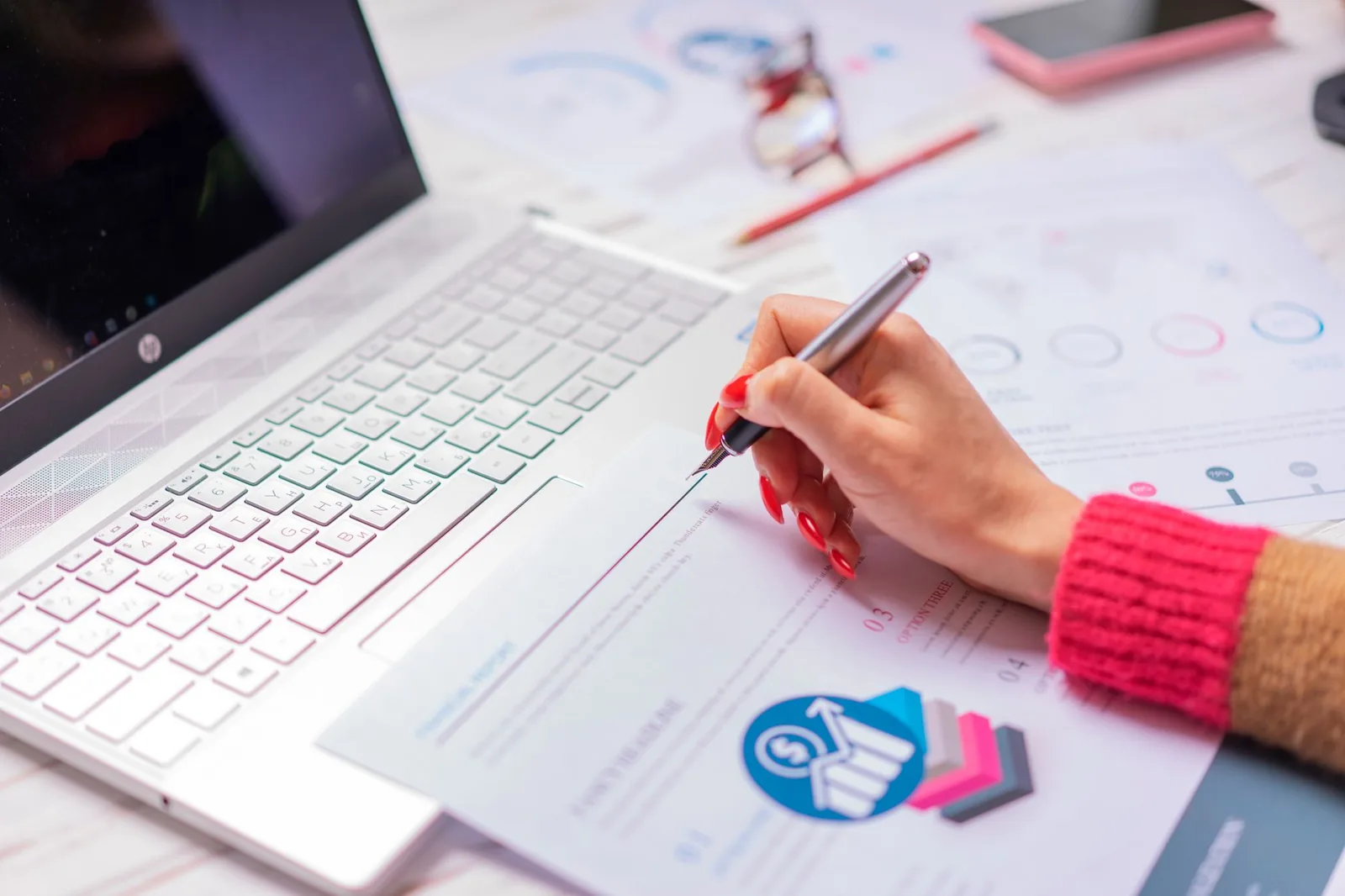 Business analyst reviewing ROI spreadsheets and financial metrics on a laptop to measure AI workflow performance