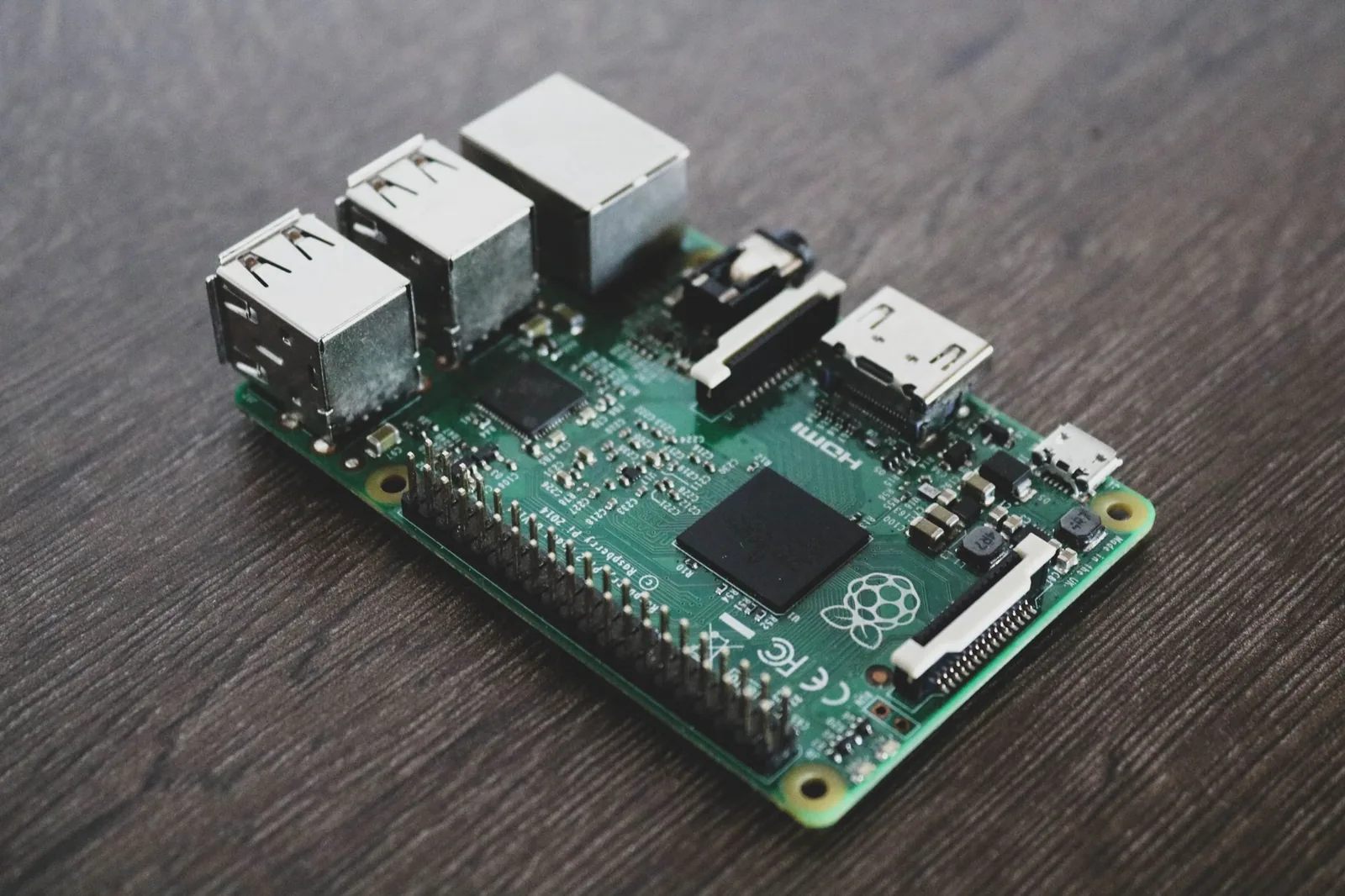 Raspberry Pi single-board computer on a developer desk running local AI inference for on-device agents