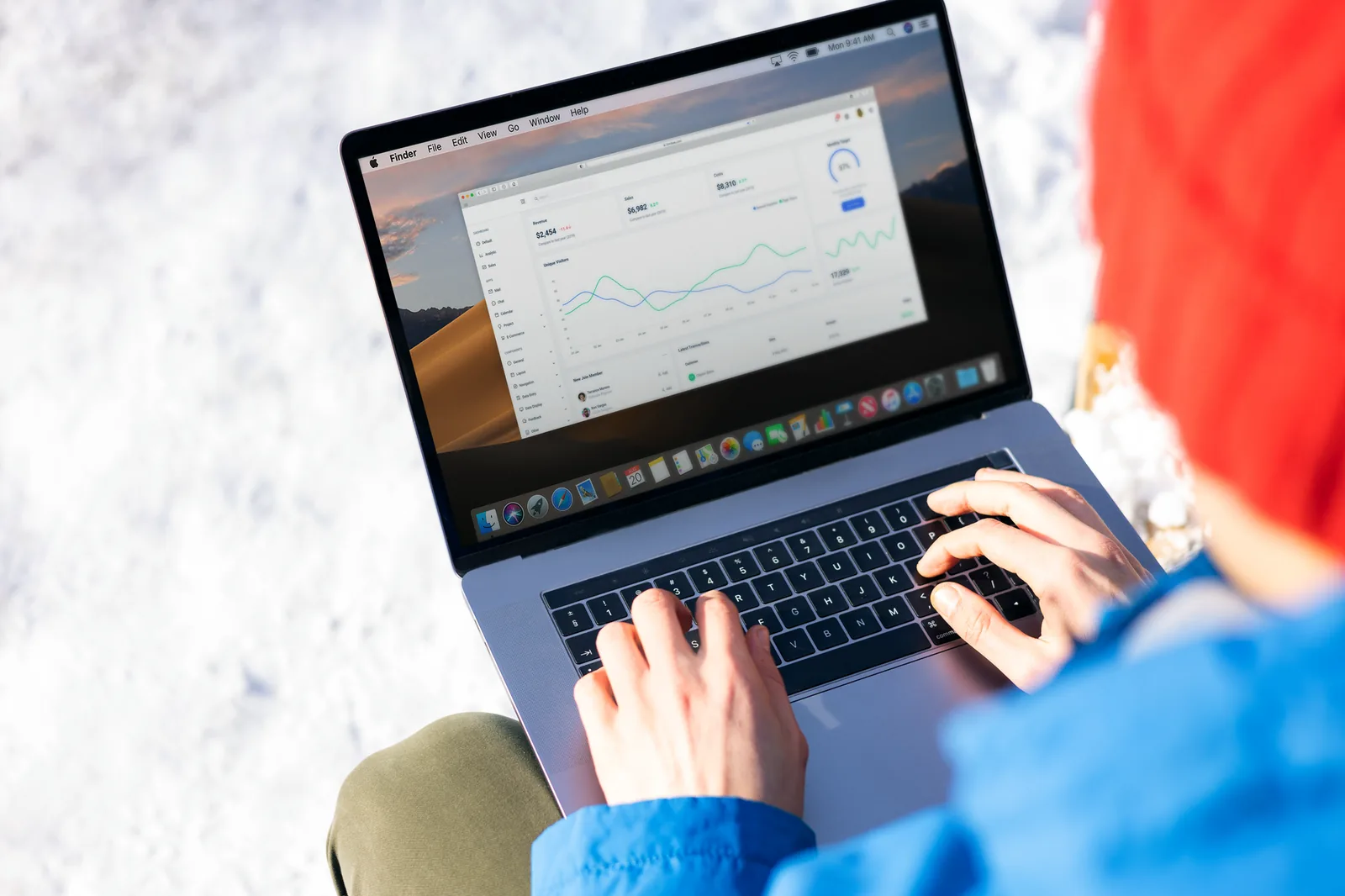 Developer reviewing Opus 5 agent ROI metrics and automation workflow costs on a laptop