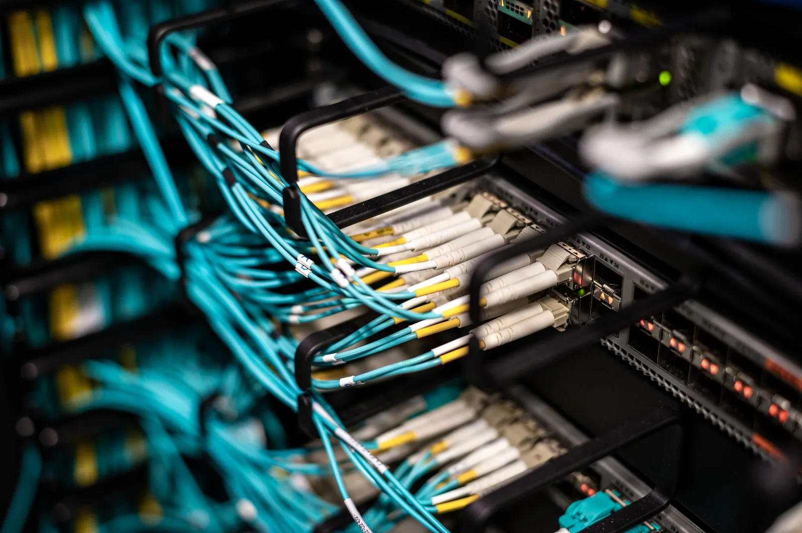 Server room with network cables representing self-hosted automation infrastructure versus managed cloud platforms
