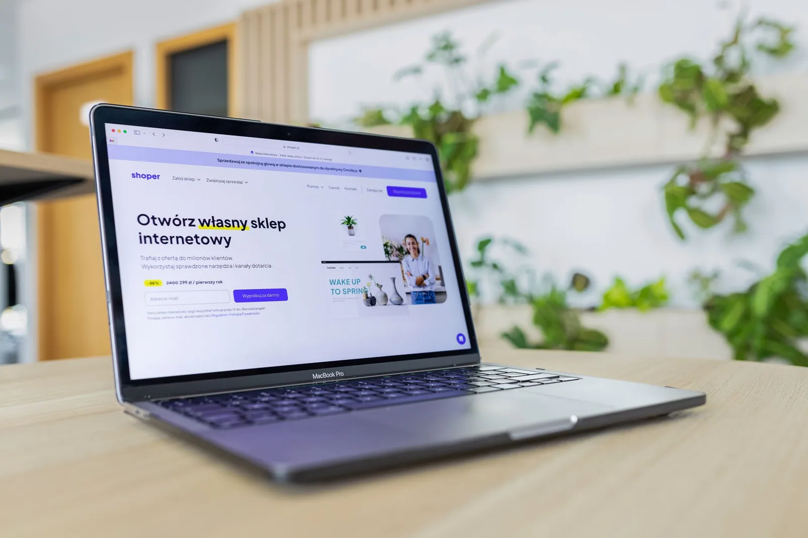 Small business owner reviewing website options on a laptop with agency and AI builder plans